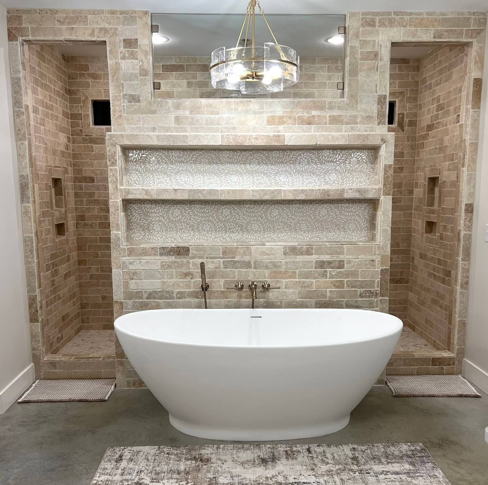 Luxury master bathroom with freestanding soaking tub and travertine tile